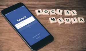 cell phone facebook tiles social media marketing